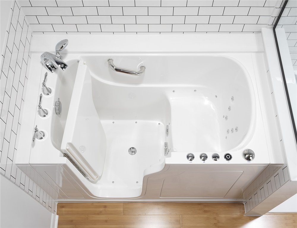 Walk in tub with a low threshold door and side jets