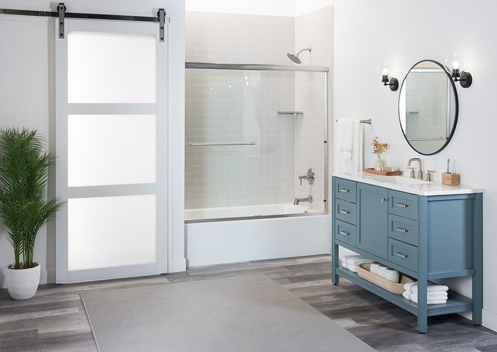 Walk in shower with a sliding glass door