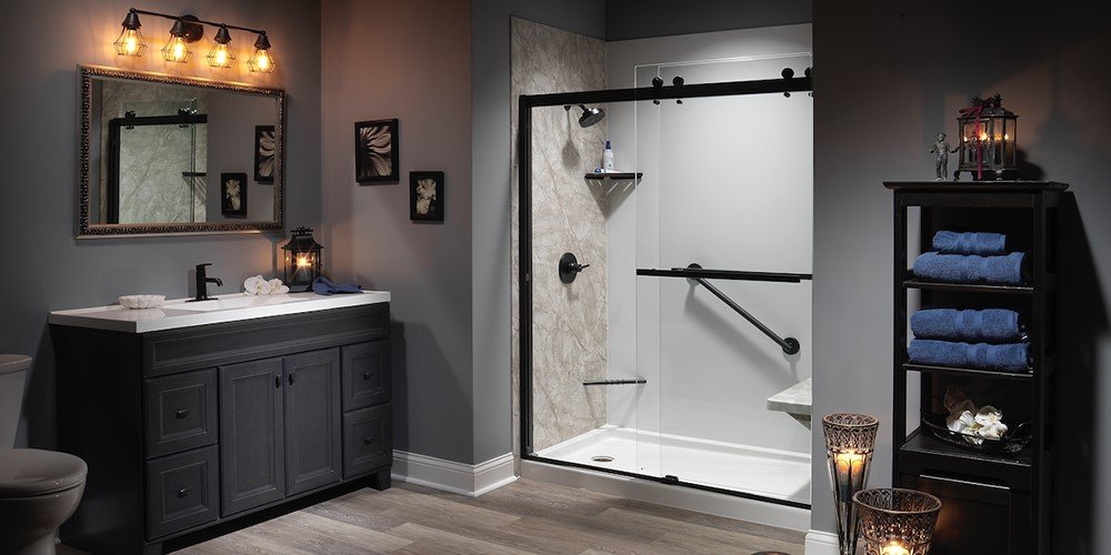 Walk in shower with a frameless sliding glass enclosure