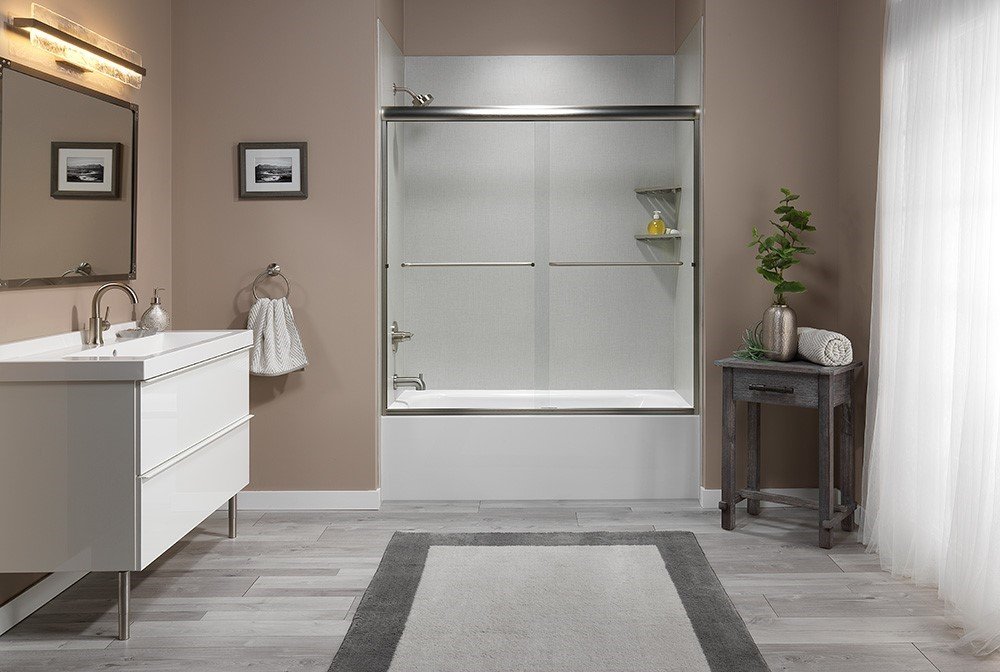 Walk in shower with a glass enclosure