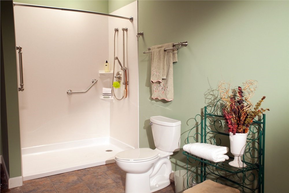 Barrier free accessible shower with grab bars