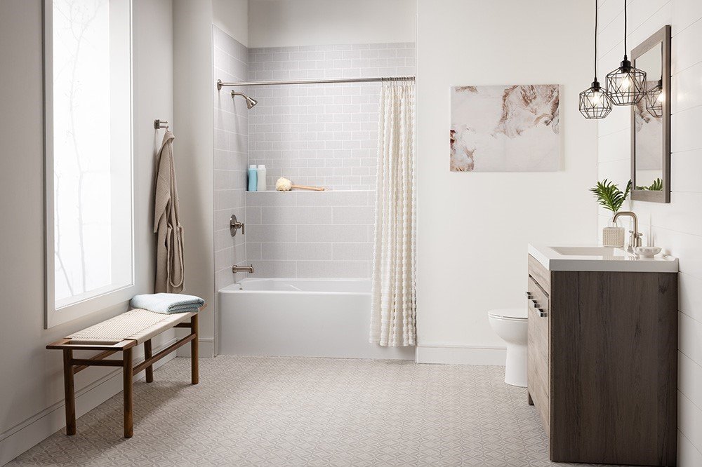 Tub and shower combo with a subway tile look and bench